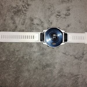 Sleek White Smartwatch with Circular Display and Minimalist Design